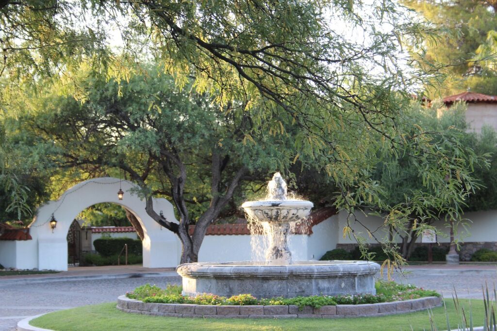a fountain near the entrance of a chapel
